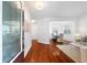 Bright entryway with hardwood floors, leading to the living and dining areas at 1955 Piedmont Cove Ln, Cumming, GA 30040