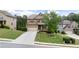 Charming two-story home with a manicured lawn and a long driveway leading to the attached garage at 1955 Piedmont Cove Ln, Cumming, GA 30040