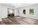 Bright open-concept living area with modern hardwood floors and lots of natural light at 1955 Piedmont Cove Ln, Cumming, GA 30040