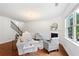 Bright living room with hardwood floors, fireplace, and staircase at 1955 Piedmont Cove Ln, Cumming, GA 30040