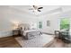 Cozy main bedroom with hardwood floors, tray ceiling, and natural light at 1955 Piedmont Cove Ln, Cumming, GA 30040