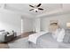 Spacious main bedroom featuring hardwood floors, tray ceiling, and recessed lighting at 1955 Piedmont Cove Ln, Cumming, GA 30040