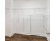 Spacious walk-in closet with wood floors and wire shelving at 1955 Piedmont Cove Ln, Cumming, GA 30040