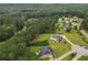 Aerial view showing lush lawns and mature trees create a private setting in this neighborhood at 3 Tiffany Trce, Palmetto, GA 30268