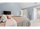 Bedroom with vaulted ceiling, blue walls, and two closets at 3 Tiffany Trce, Palmetto, GA 30268