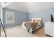 Bedroom with vaulted ceiling, blue walls, and white furniture at 3 Tiffany Trce, Palmetto, GA 30268