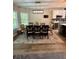 Inviting dining room with modern lighting, neutral tones, and picturesque window view at 3 Tiffany Trce, Palmetto, GA 30268