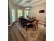 Comfortable dining room featuring modern lighting, with an outdoor view from surrounding windows at 3 Tiffany Trce, Palmetto, GA 30268