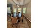 Comfortable dining room featuring modern lighting, with an outdoor view from surrounding windows at 3 Tiffany Trce, Palmetto, GA 30268