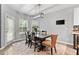 Dining room with chandelier, gray walls, wood floors and an exterior door for access to the back yard at 3 Tiffany Trce, Palmetto, GA 30268