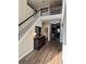 Inviting entryway featuring hardwood floors, a staircase, and stylish console table at 3 Tiffany Trce, Palmetto, GA 30268