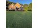 Traditional two-story home with lush lawn and mature trees in a desirable neighborhood at 3 Tiffany Trce, Palmetto, GA 30268