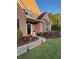 Lovely home exterior featuring a brick facade, manicured flower beds, and walkway lighting at 3 Tiffany Trce, Palmetto, GA 30268