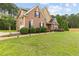 Beautiful home with lush green lawn, landscaping, and a side-entry garage at 3 Tiffany Trce, Palmetto, GA 30268