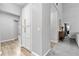 Hallway features wood floors and neutral paint with custom cabinets and trim at 3 Tiffany Trce, Palmetto, GA 30268