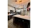 Kitchen featuring a wine cooler, pendant lighting, counter seating, and stainless steel appliances at 3 Tiffany Trce, Palmetto, GA 30268