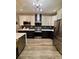 Modern kitchen with stainless steel appliances, a dark backsplash, and two-tone cabinetry at 3 Tiffany Trce, Palmetto, GA 30268