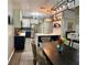 Open concept kitchen/living area featuring island seating and easy access to the living room at 3 Tiffany Trce, Palmetto, GA 30268