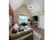 Spacious living room featuring a sectional couch, area rug, and a modern chandelier at 3 Tiffany Trce, Palmetto, GA 30268