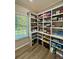 Spacious pantry with floor-to-ceiling shelving providing ample storage space at 3 Tiffany Trce, Palmetto, GA 30268