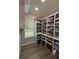 Spacious pantry with floor-to-ceiling shelving providing ample storage space at 3 Tiffany Trce, Palmetto, GA 30268