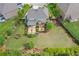 Expansive lawn and a custom patio with seating and manicured landscaping at 3179 Falls Crest Ct, Buford, GA 30519