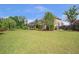 Expansive backyard with lush green lawn, mature trees, and well-maintained landscaping at 3179 Falls Crest Ct, Buford, GA 30519