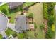 Aerial view of the landscaped backyard, complete with deck and fire pit seating area at 3179 Falls Crest Ct, Buford, GA 30519