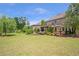 The expansive backyard with mature trees and landscaping provides endless outdoor possibilities at 3179 Falls Crest Ct, Buford, GA 30519
