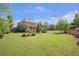 Beautifully landscaped backyard on a large lot with patio is perfect for outdoor enjoyment at 3179 Falls Crest Ct, Buford, GA 30519