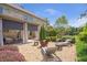 Outdoor patio featuring a fire pit, lounge chairs, and elegant landscaping at 3179 Falls Crest Ct, Buford, GA 30519
