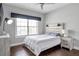 Charming bedroom with modern furnishings, natural light, and wood flooring at 3179 Falls Crest Ct, Buford, GA 30519