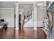 Welcoming entryway with hardwood floors and views of the staircase and living areas at 3179 Falls Crest Ct, Buford, GA 30519