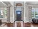 Grand foyer featuring soaring ceilings, hardwood floors, and statement decor at 3179 Falls Crest Ct, Buford, GA 30519