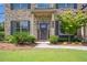 Inviting front entrance with well-maintained landscaping and charming front door at 3179 Falls Crest Ct, Buford, GA 30519