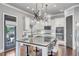 Modern kitchen with a large island, stainless steel appliances, and stylish pendant lighting at 3179 Falls Crest Ct, Buford, GA 30519