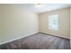 Neutral bedroom with plush carpet, a window, and new paint at 3242 College St, Atlanta, GA 30337
