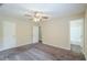 Bedroom featuring plush carpet, ceiling fan, and attached bath at 3242 College St, Atlanta, GA 30337