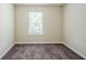 Neutral bedroom with brown carpet and a window at 3242 College St, Atlanta, GA 30337