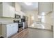 Modern kitchen featuring white cabinets, stainless steel appliances, and granite countertops at 3242 College St, Atlanta, GA 30337