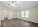 Open living room space with hard wood floors and natural light at 3242 College St, Atlanta, GA 30337