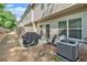 Backyard patio with grill and seating, perfect for outdoor entertaining at 450 Rockfern Ct, Lilburn, GA 30047
