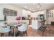 Dining area adjoining the kitchen featuring a modern table, chairs, and stylish decor at 450 Rockfern Ct, Lilburn, GA 30047