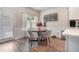 Cozy breakfast nook with a round table, chairs, and lots of natural light at 450 Rockfern Ct, Lilburn, GA 30047