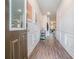 Inviting foyer with wood floors and elegant wall paneling leading to the living area at 450 Rockfern Ct, Lilburn, GA 30047