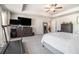 Spacious carpeted main bedroom with a bed, dresser, and treadmill at 450 Rockfern Ct, Lilburn, GA 30047