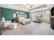 Spacious main bedroom offers a seating area and a treadmill next to windows at 450 Rockfern Ct, Lilburn, GA 30047