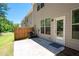 Backyard patio and privacy fence on a sunny day at 213 Yellowwood Way, Woodstock, GA 30188