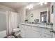 Bathroom with double vanity, granite counters, and tub shower at 213 Yellowwood Way, Woodstock, GA 30188