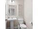 Powder room with pedestal sink, toilet, decorative mirror, and light fixture at 213 Yellowwood Way, Woodstock, GA 30188
